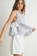 Load image into Gallery viewer, Woman wearing a sleeveless checkered top and white shorts on a plain background
