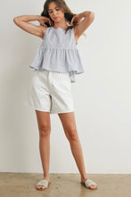 Load image into Gallery viewer, Woman wearing a checkered top and white shorts against a plain background