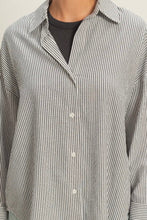 Load image into Gallery viewer, Close-up of a person wearing a striped shirt with a neutral background