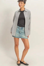 Load image into Gallery viewer, Woman wearing a checkered shirt, black top, denim shorts, and black flats on a white background