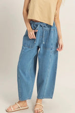 Load image into Gallery viewer, Person wearing blue denim pants on a plain background