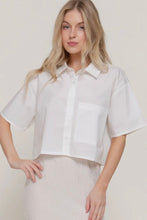 Load image into Gallery viewer, Woman wearing a white short-sleeve blouse against a plain background