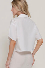 Load image into Gallery viewer, Woman wearing a white short-sleeve shirt against a plain background
