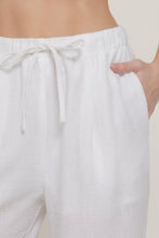 Load image into Gallery viewer, White pants with a drawstring waist on a plain background