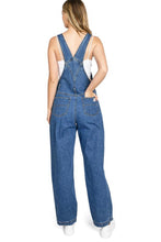 Load image into Gallery viewer, Person wearing blue denim overalls on a white background