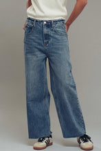 Load image into Gallery viewer, Person wearing blue jeans with a plain background