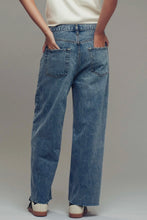 Load image into Gallery viewer, Person wearing blue jeans on a plain background