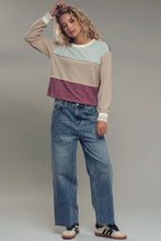 Load image into Gallery viewer, Person wearing a color-blocked sweater and jeans on a plain background
