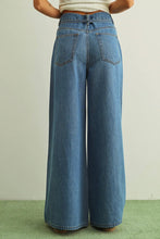 Load image into Gallery viewer, Wide-leg jeans worn by a person on a plain background