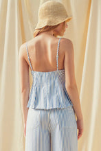 Load image into Gallery viewer, Woman wearing a blue and white striped outfit with a straw hat against a beige curtain.