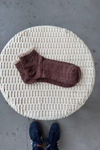 Load image into Gallery viewer, Brown sock on a woven stool with a concrete floor background
