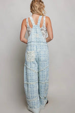 Load image into Gallery viewer, Person wearing a checkered overalls with lace details on a plain background