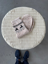 Load image into Gallery viewer, Round woven stool with a folded blanket on a concrete floor