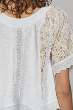 Load image into Gallery viewer, White top with floral sleeves and lace details on a plain background