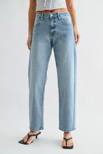 Load image into Gallery viewer, Light blue jeans worn by a person on a plain background