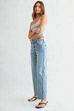 Load image into Gallery viewer, Woman wearing a gray tank top and light blue jeans on a white background
