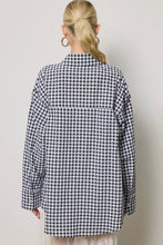 Load image into Gallery viewer, Person wearing a black and white checkered shirt against a plain background