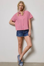 Load image into Gallery viewer, Woman wearing a red and white checkered shirt and denim shorts against a plain background