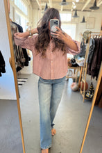 Load image into Gallery viewer, Person taking a mirror selfie wearing a striped shirt and jeans in a clothing store.