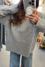 Load image into Gallery viewer, Person wearing a gray cable knit sweater taking a mirror selfie.