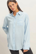 Load image into Gallery viewer, Woman wearing a light blue shirt against a plain background