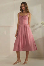 Load image into Gallery viewer, Woman wearing a red and white checkered dress against a neutral background