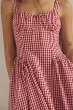 Load image into Gallery viewer, Red and white checkered dress worn by a person on a neutral background