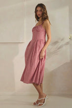 Load image into Gallery viewer, Woman wearing a red checkered dress against a neutral background