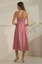 Load image into Gallery viewer, Woman wearing a red and white checkered dress against a neutral background