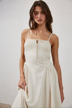 Load image into Gallery viewer, Woman wearing a white dress against a plain background