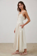 Load image into Gallery viewer, Woman wearing a white dress with thin straps against a plain background