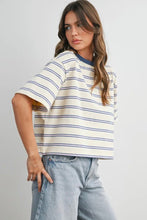 Load image into Gallery viewer, Woman wearing a striped shirt and jeans against a plain background