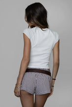 Load image into Gallery viewer, Person wearing a white top and checkered shorts on a plain background
