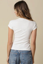 Load image into Gallery viewer, Person wearing a white t-shirt and blue jeans on a beige background
