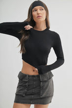 Load image into Gallery viewer, Woman wearing a black long-sleeve crop top and denim skirt on a white background