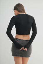 Load image into Gallery viewer, Person wearing a black long-sleeve crop top and denim skirt on a plain background