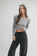 Load image into Gallery viewer, Woman wearing a gray long-sleeve top and black pants on a white background