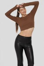 Load image into Gallery viewer, Person wearing a brown long-sleeve top and black leather pants on a white background