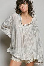 Load image into Gallery viewer, Woman wearing a loose-fitting, striped blouse with ruffled details on a plain background