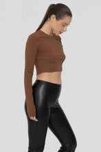 Load image into Gallery viewer, Woman wearing a brown long-sleeve crop top and black leather pants on a light gray background