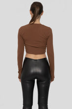 Load image into Gallery viewer, Person wearing a brown long-sleeve crop top and black leather pants on a white background