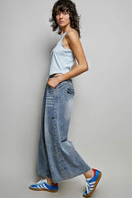 Load image into Gallery viewer, Woman wearing a light blue tank top and denim wide-leg pants on a gray background