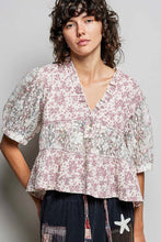 Load image into Gallery viewer, Person wearing a floral blouse with a plain background
