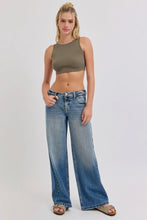 Load image into Gallery viewer, Woman wearing a green tank top and blue jeans on a white background