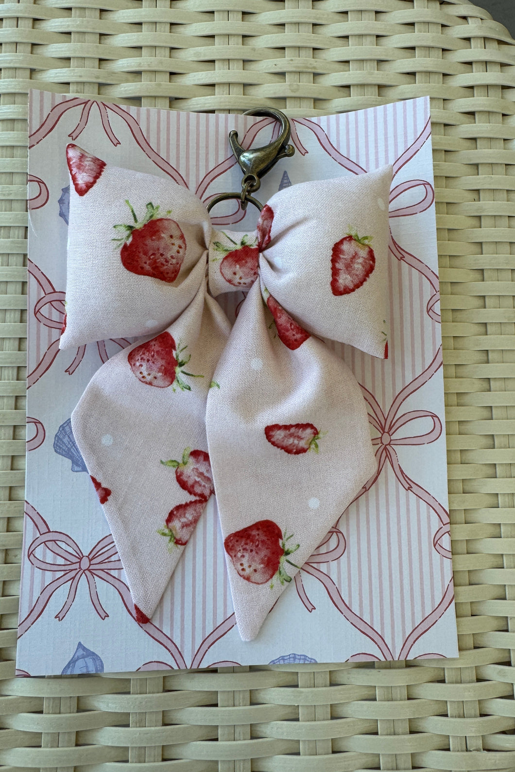 Fabric with strawberry pattern on a woven surface