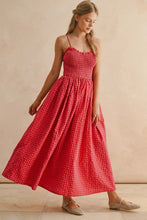 Load image into Gallery viewer, Woman wearing a red checkered dress against a beige background