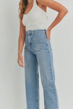 Load image into Gallery viewer, Person wearing light blue jeans and a white ribbed tank top on a plain background