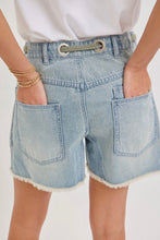 Load image into Gallery viewer, Light blue denim shorts worn by a person on a white background