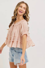 Load image into Gallery viewer, Woman wearing a pink blouse and denim shorts on a white background