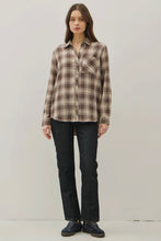 Load image into Gallery viewer, Woman wearing a plaid shirt and dark jeans on a plain background